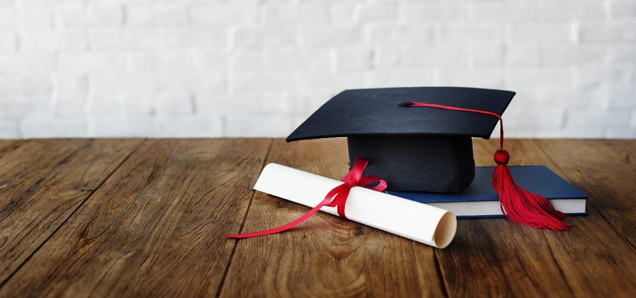 image of a graduate cap and diploma