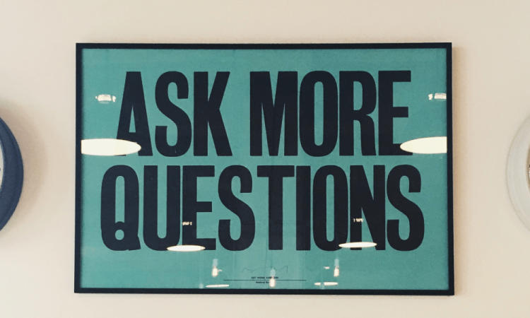 image of a a ask more questions sign